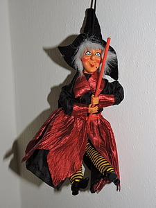 witch holding broom Halloween decor thumbnail