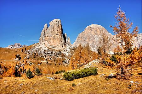 brown rocky mountain under blue sky during daytime thumbnail