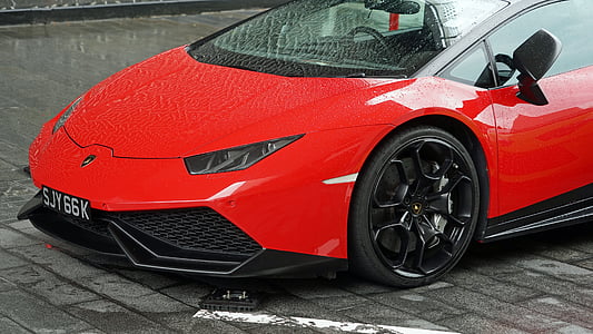 closeup photography of red Lamborghini Huracan during daytime thumbnail