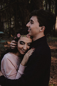 man hugging a woman during daytime thumbnail