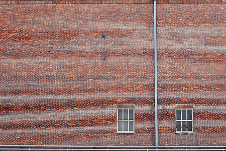brown brick wall with white window panes thumbnail