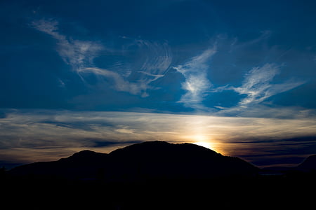 silhouette photography of mountain under golden hour thumbnail