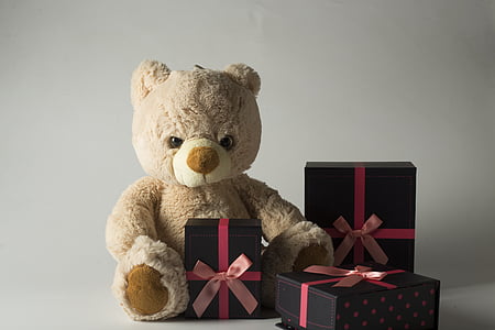 white bear plush toy with three black boxes thumbnail