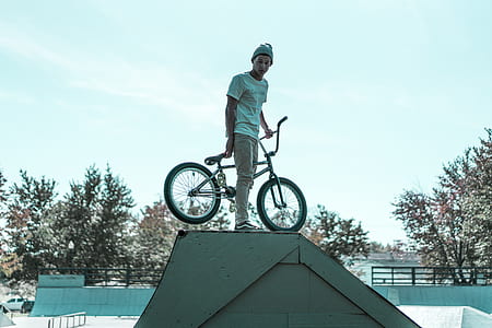 man riding bicycle during day time thumbnail