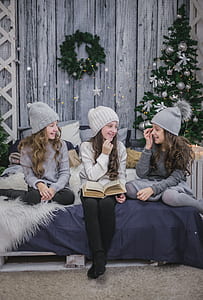 three girls sitting on bed thumbnail