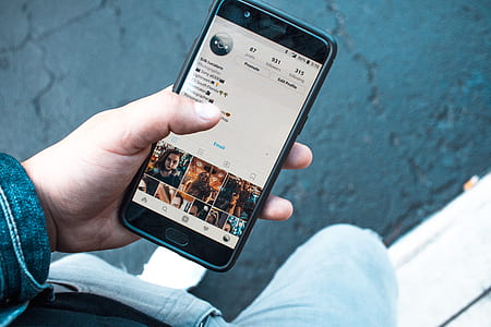 person holding turned on black Android smartphone thumbnail
