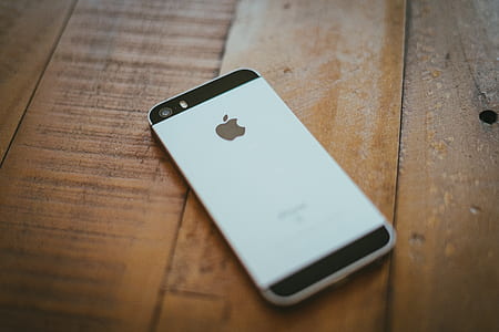 space gray iPhone 5s on brown wooden surface thumbnail