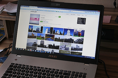 gray and black Asus laptop turned-on thumbnail