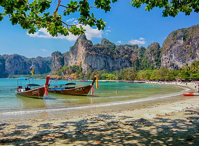 two boats by the seashore during daytime thumbnail