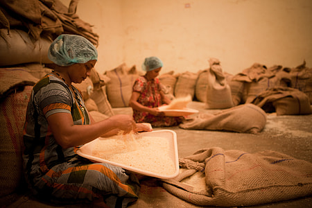 woman holding tray with rice thumbnail