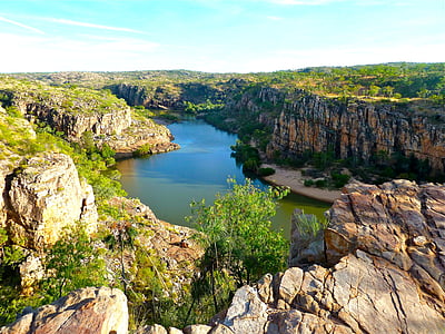 aerial photography of river between cliffs thumbnail