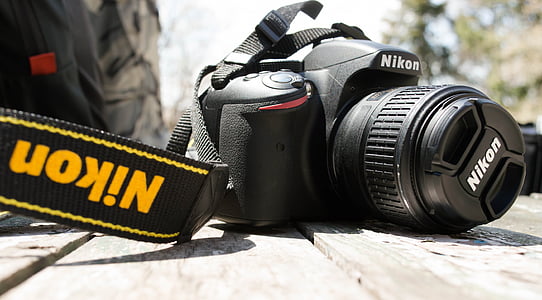 closeup photography of black Nikon DSLR camera thumbnail