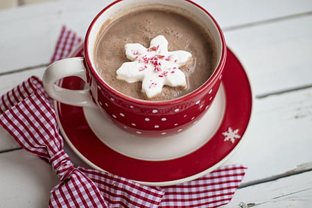 white and red ceramic coffee mug and saucers thumbnail