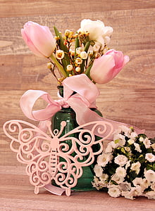 pink tulips with lace decor on tabl thumbnail