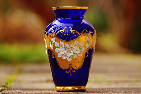 selective focus photography of blue and gold vase thumbnail