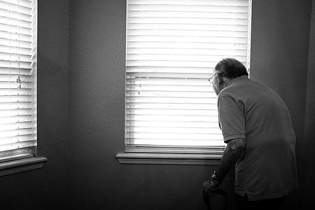 man standing in front of window thumbnail