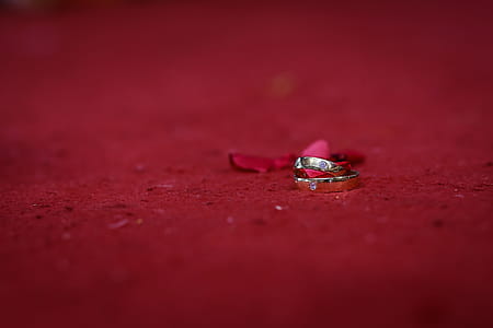 Two Silver Rings on Red Surface thumbnail