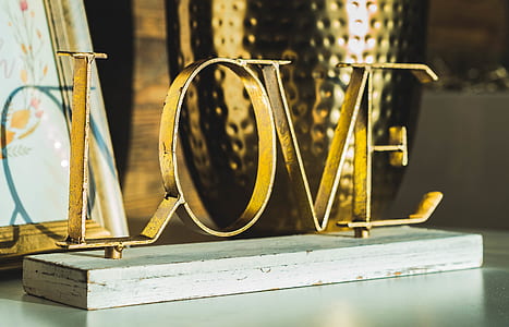 closeup photography of brass-colored love decorative letter thumbnail