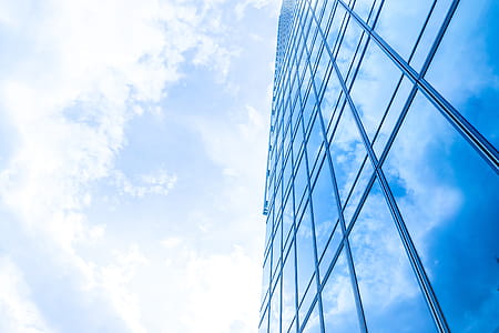 Windows of Skyscraper Business Office with blue sky, Corporate building in city. thumbnail