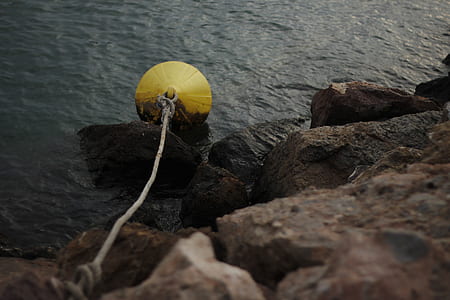 yellow plastic container on the water thumbnail