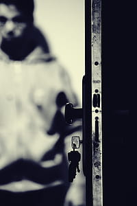 Monochrome Photo of Keys and Door Knob thumbnail