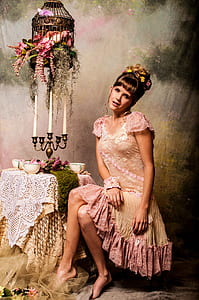 woman sitting beside table with bowls thumbnail