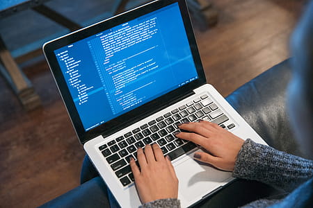 Hands Typing Code On Laptop Photo thumbnail