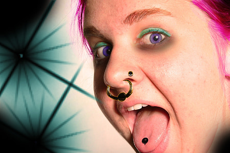 woman with gold-colored nose piercing thumbnail
