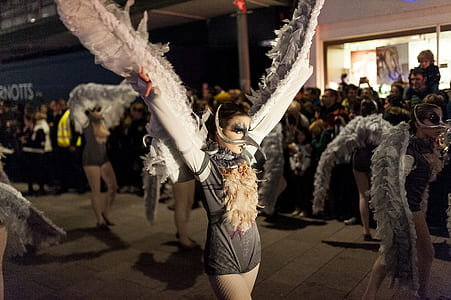 woman in gray costume standing thumbnail