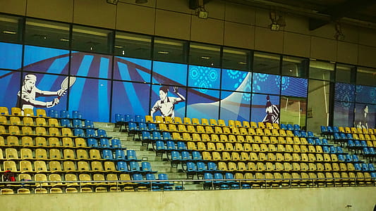 Yellow and Blue Seats Inside Court thumbnail