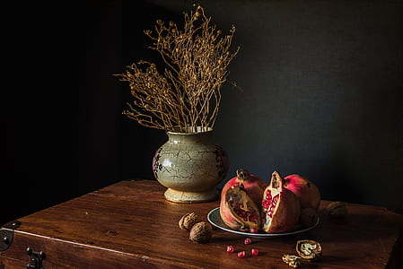 slice pomegranate on blue plate thumbnail