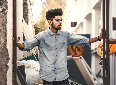 man wearing blue denim button-up shirt thumbnail