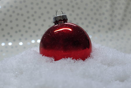 photo of red bauble on top of white surface thumbnail