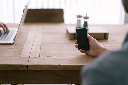 person holding smartphone thumbnail