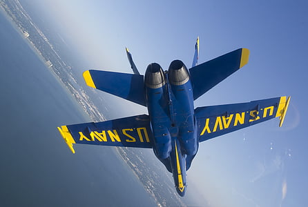 blue and yellow U.S. Navy aircraft on air thumbnail