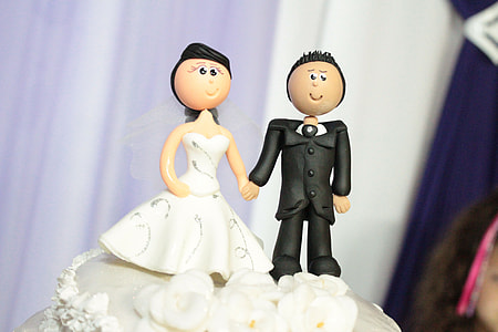 wedding couple cake toppers on wedding cake thumbnail