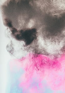 time lapse photography of black and pink smokes thumbnail