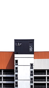 white, black, and orange concrete building thumbnail