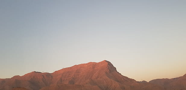 brown mountain under clear skies thumbnail