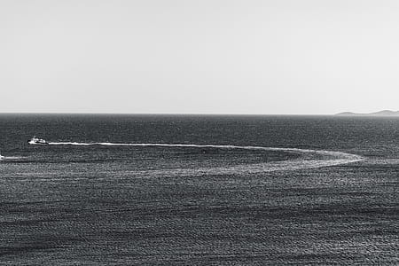 speedboat on body of water leaving trail thumbnail