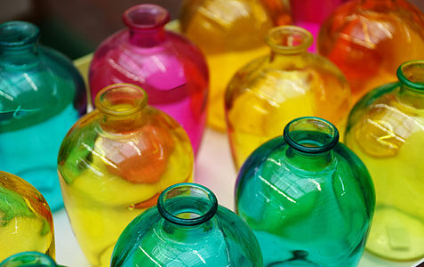 selective focus photography of assorted-color glass vase lot thumbnail