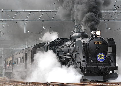 grayscale photograph of train with heavy smoke thumbnail