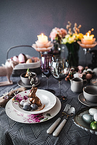 Round dinner table decorated with easter motifs thumbnail
