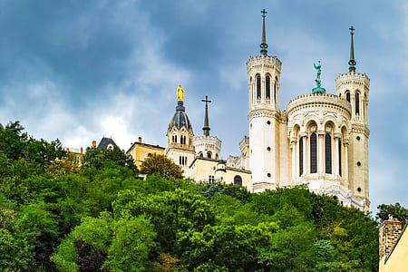 white building under dark clouds thumbnail
