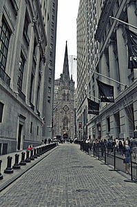 people walking at the side of the road near building during day thumbnail