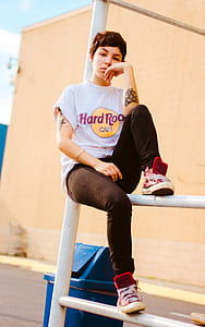 girl sitting on white metal scaffolding thumbnail