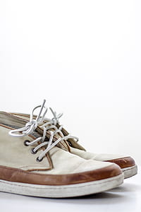 pair of white-and-beige dress shoes on white background thumbnail
