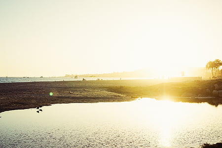 body of water under white sky at daytime thumbnail