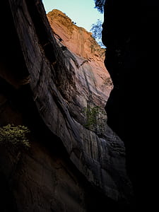 low-angle photography of cave during daytime thumbnail