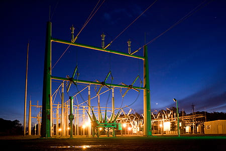 green electrical power plant post during nighttime thumbnail
